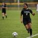 Huron High School senior Ify Odum handles the ball up the sideline in the game against Dexter on Tuesday, April 23. They tied 1-1. Daniel Brenner I AnnArbor.com